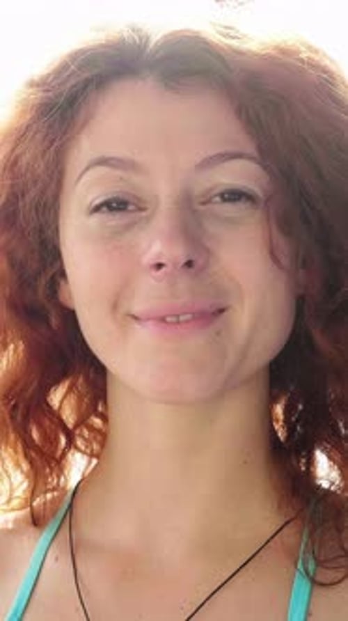Smiling Woman with Red Hair Close Up Portrait