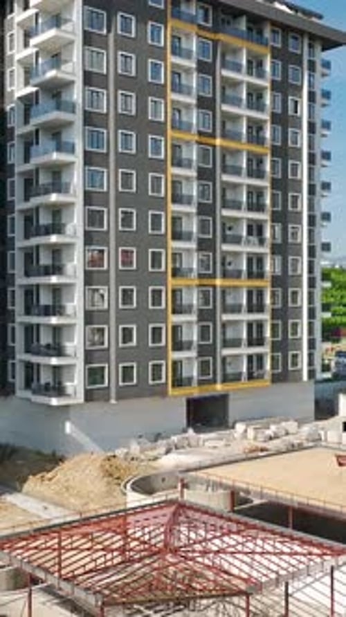 Vertical Video Skyward Ascent HighRise Building Construction in Alanya Turkey