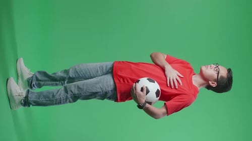 Full Body Of Asian Man With A Ball Putting Hand On His Heart To Respect On Green Screen Background