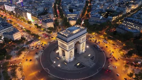 Night aerial shot of Arc de Triomphe (Arch of Triumph) in Paris, France