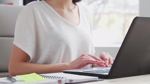 Young Woman Works at Home Office Using Computer Workplace of Female Entrepreneur Freelancer or