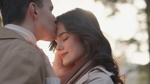 Loving Couple Embrace in the Golden Sunlight