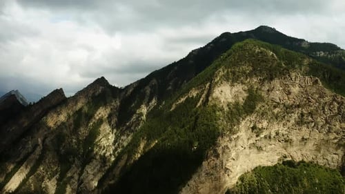 The Mountain Range is Covered with Green Trees High Peaks in Rocky Terrain Aerial Photography