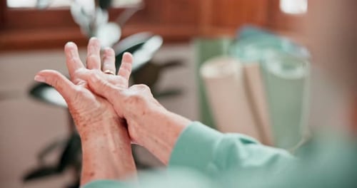 Senior Massaging Hand for Pain Relief Close Up