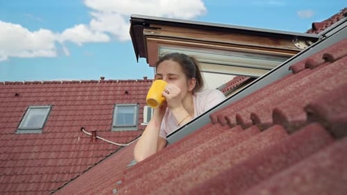 Young Woman Enjoying Rooftop View with Coffee