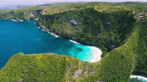 Turquoise Sea Water and Tropical Rocks on Kelingking Beach Nusa Penida Island Bali Indonesia