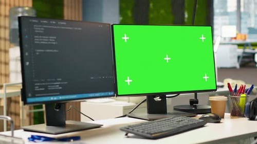 Green Screen PC Display on Startup Office Desk Showing Programming Languages