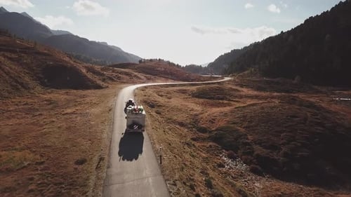 Aerial View of Rural Road with Travelling Cars and Kayaks on the Roof