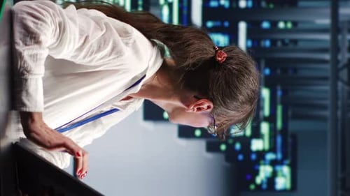 Data Center Employee Using Tablet for Management