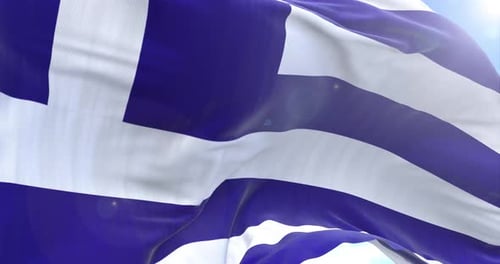Waving Greek Flag Against Blue Sky Background