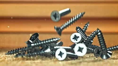 Selftapping Screws Fall on a Wooden Surface Filmed on a Highspeed Camera at 1000 Fps