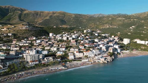 Aerial Pullback Reveals Albanian Riviera Coastal Town of Himare, Albania
