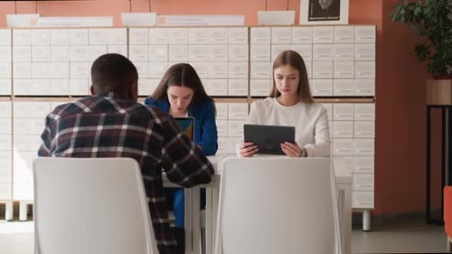 Visitors Work on Computers in Library Hall