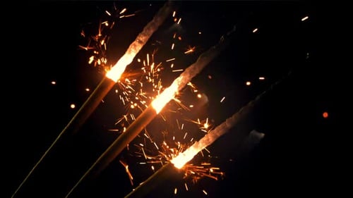 Sparkling Light from Burning Festive Sparklers at Night