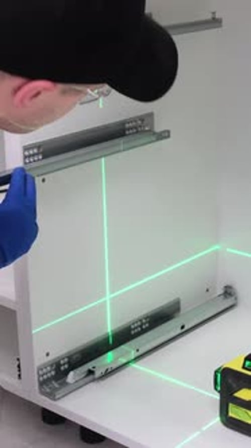 Man Installs Drawer Rails with Laser Precision