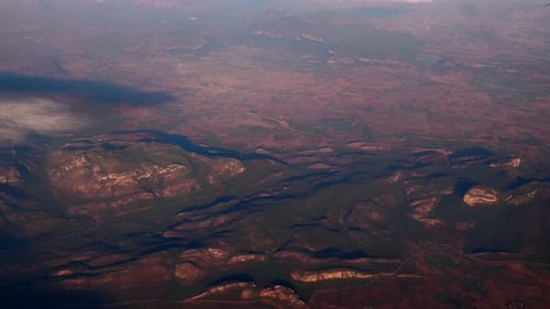 Aerial view of beautiful landscape of mountains and tree and shrubs and clouds