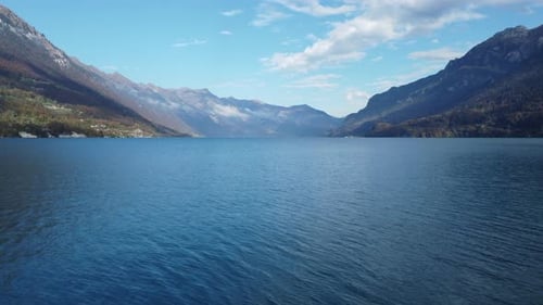 Interlaken Switzerland Frontal View: Scenic Alpine Town, Lake Thun, and Bernese Oberland Skyline