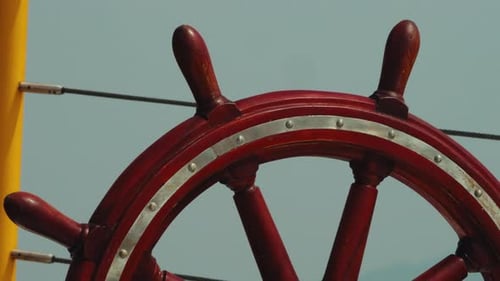 The ship's rudder is red. Zoom out shot