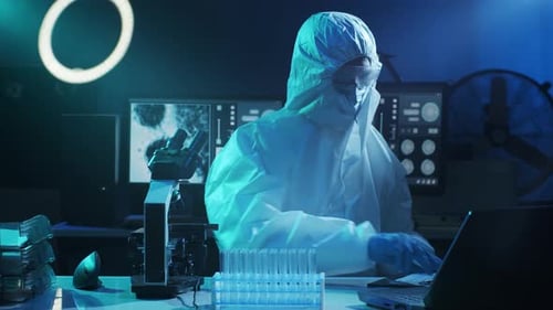 Scientist in Protective Suit Doing Research