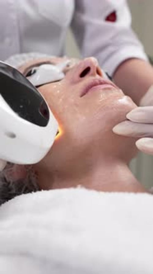 Cosmetic Procedure on Person's Face at Medical Facility