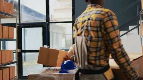 Warehouse Workers Packing Boxes for Delivery
