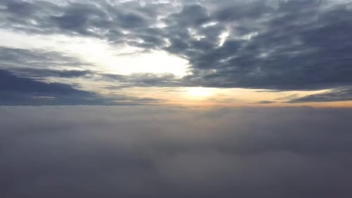 Dramatic Sunrise over a Sea of Clouds