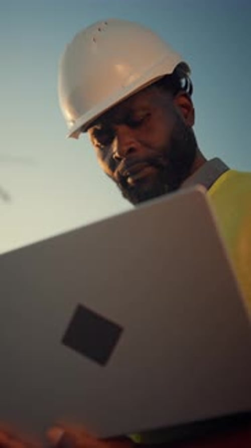 Architect or Inspector with Laptop in Construction Site Portrait of Builder Professional Vertical