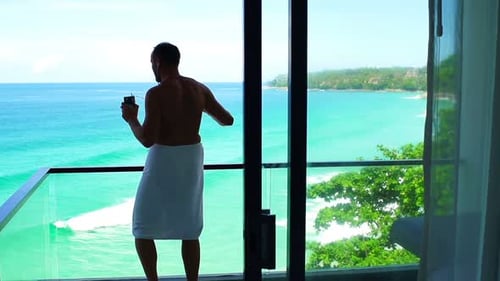 Man in Towel Dancing While Listening to Music on Terrace Adult