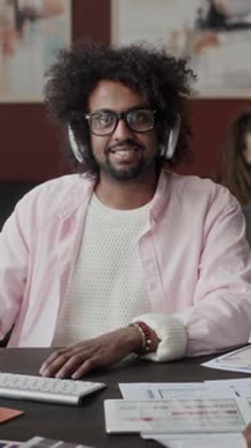 Vertical Portrait of Biracial Male Interior Designer at Workplace