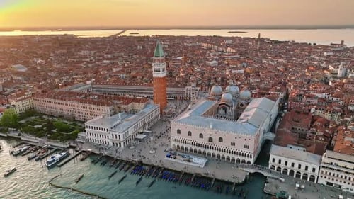 Aerial drone view of St. Mark's Square with Venice City, Italy in the background, on a sunny day