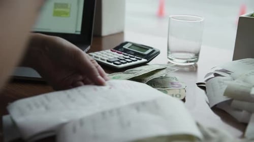 Cafe Owner with Receipts