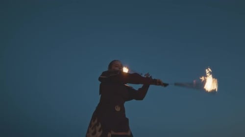 Girl Spin and Juggle Fire during Night Show