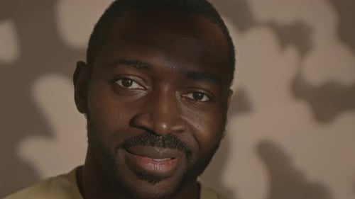 Close-up Portrait of a Man Against a Neutral Background