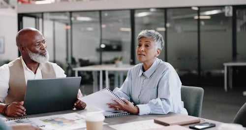 Laptop, documents and meeting with a business team in the boardroom for planning or strategy