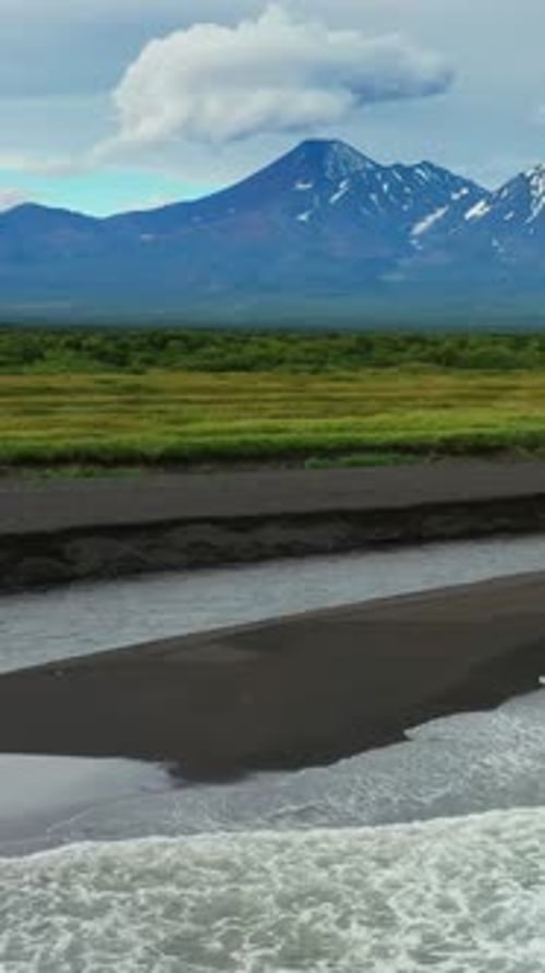 Beach with Black Sand and Volcano