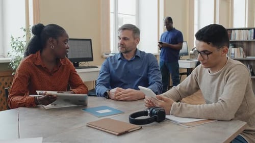 Modern Teacher Working With Multi-ethnic Students
