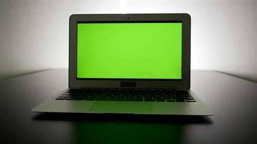 Computer Screen Isolated on GreenScreen Background Chroma Key in City Office