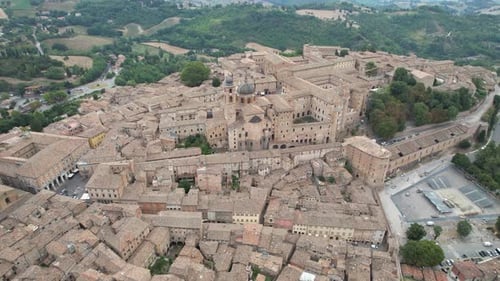 Aerial view of Urbino, Italy, showcasing the intricate layout of its historic center and the iconic