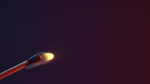 White Smoke From an Extinguished Match on Dark Background