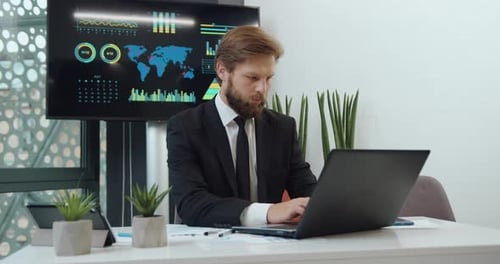 Portrait of business man office manager in formal clothes which working on computer in modern office