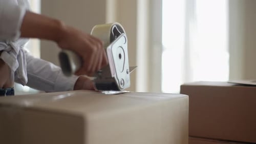 Closeup Hands of Unrecognizable African Female Leaving Rented Flat Pack Their Personal Belongings in