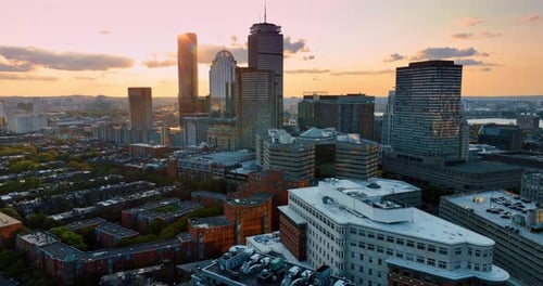 Drone footage approaching beautiful modern tower blocks in Boston downtown.