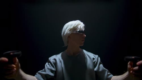 Guy Playing Vr Game in Futuristic Glasses Dark Room