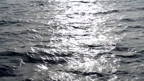 Peacful rolling ocean waves in the sunset