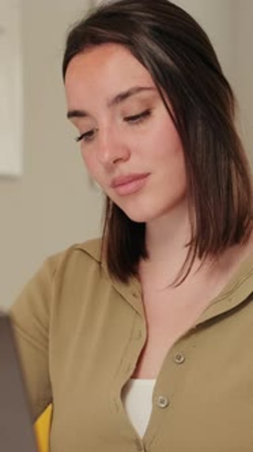 Vertical video, Woman Working From Home on Laptop