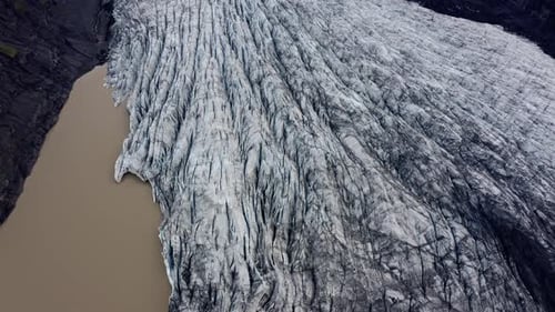 Aerial view of glacier meeting water, Iceland.