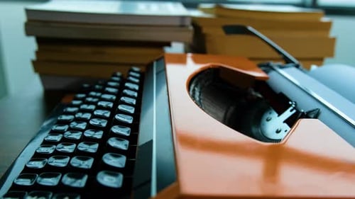 Writing letters with orange retro vintage typewriter