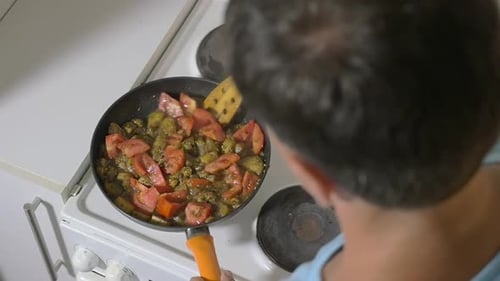 Adult Cooking Healthy Vegetables on Stove Top