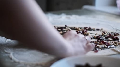 Rolling Dough with Chocolate Filling and Nuts