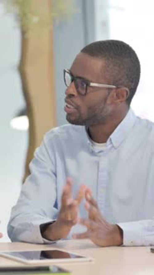 Young Business People Discussing Work in Office, vertical video